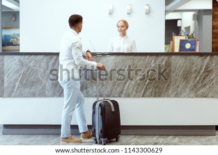 Similar – Image, Stock Photo departed I The hotel key with pendant and the number 7 lies on an unmade white covered bed