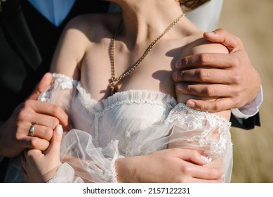 Man Hug Woman. The Bride And Groom Embracing On Wedding Ceremony Of The Outdoor In The Nature Backyard. Goosebumps Appeared On Body Of A Young Bride From Touch Man. Skin Texture. Close Up.