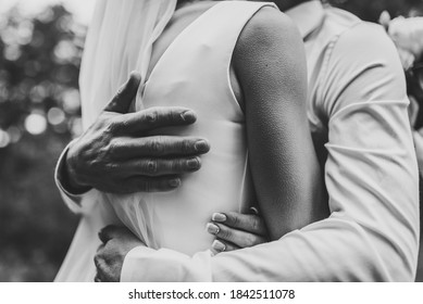 Man Hug Woman. Goosebumps Appeared On Body Of A Young Beautiful Bride From Touch Man. Beautiful Skin Texture. A Groom Gently Embraces Girl By Shoulders To Goosebumps. Close Up. Black And White Photo.