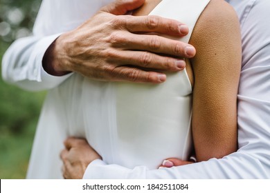 Man Hug Woman. Goosebumps Appeared On Body Of A Young Beautiful Bride From Touch Man. Beautiful Skin Texture. A Groom Gently Embraces Women In A Wedding Dress.