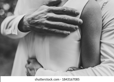 Man Hug Woman. Goosebumps Appeared On Body Of A Young Beautiful Bride From Touch Man. Beautiful Skin Texture. A Groom Gently Embraces Girl By Shoulders To Goosebumps. Close Up. Black And White Photo.