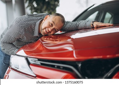 Man Hugging A Car