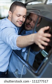 Man Hugging A Car In A Car Dealership