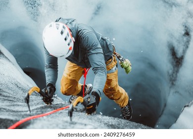 A man ice climbing on a glacier in Iceland - Powered by Shutterstock