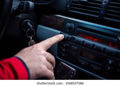 Man includes an audio system in the car.
