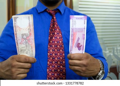 a man with indian currency 
