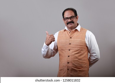 Man of Indian origin shows thumbs up gesture