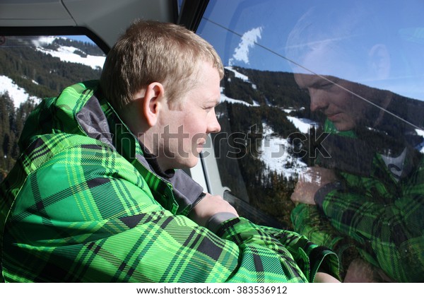 Man inside the cabin. Cable car in Zell\
am See, skiing resort in North Tirol,\
Austria.