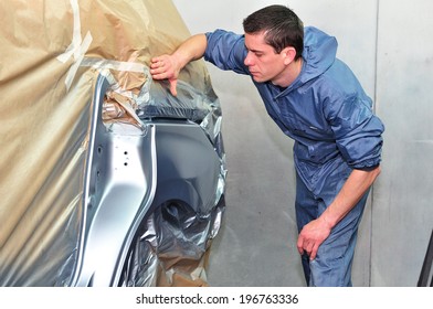 Man Inspecting Newly Painted Car.