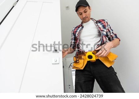 Man installing door architrave repair