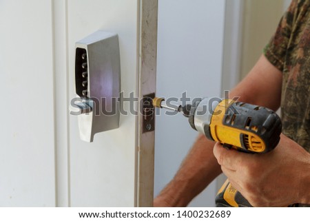 Man installing of the door lock security