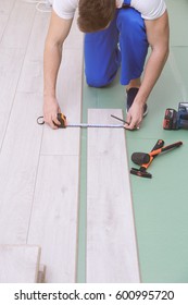 Man Installing New Wooden Laminate Flooring