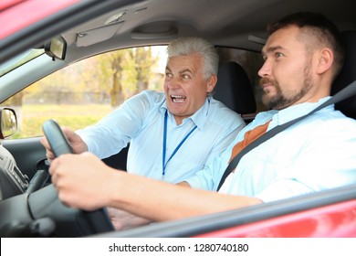 Man and instructor in car. Fail driving license exam