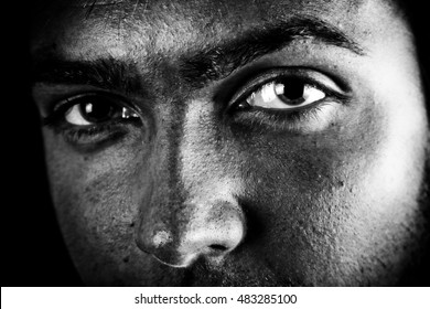 Man with intense eyes. High contrast black and white. - Shutterstock ID 483285100