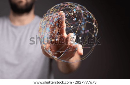 Man interacting with a colorful network sphere concept