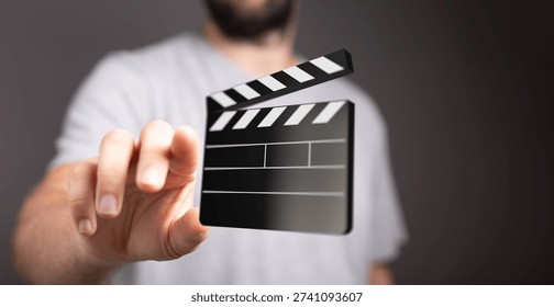 Man Interacting with Digital Clapperboard