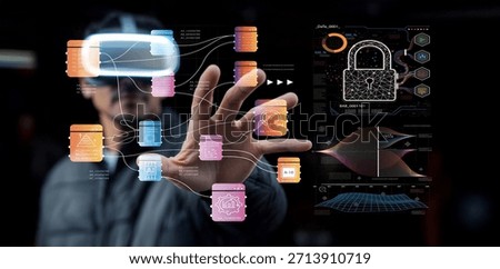 A man interacts with a digital interface while wearing a virtual reality headset, showcasing advanced data visualization and cybersecurity elements in a modern environment.