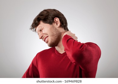 Man isolated has a strong neck pain 