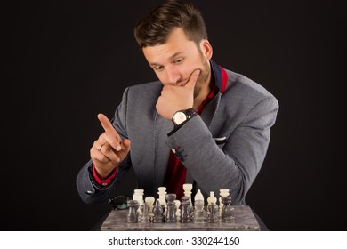 Man in jacket playing chess