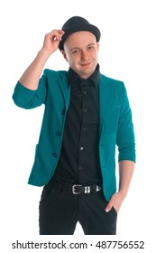 Man in a jacket is touching his hat and smiling