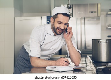 Man japanese restaurant chef working in the kitchen - Powered by Shutterstock