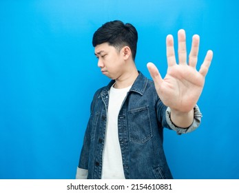 Man Jean Shirt Show Hand Stop Turn Away Face Serious Emotion Blue Background