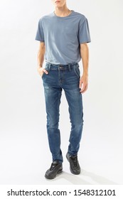 man in jeans, denim pants close up on white background, blue jeans, blue t-shirt