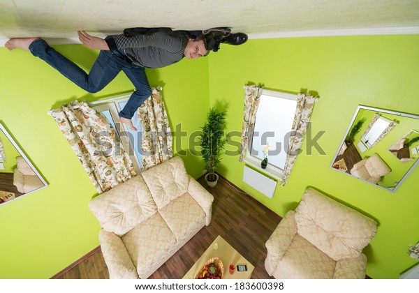 Man Jeans Lying On Ceiling Under Stock Photo Edit Now 183600398