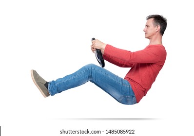 Man In Jeans And Red T-shirt Drives A Car With A Steering Wheel, Isolated On White Background. Auto Driver Concept
