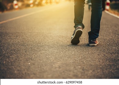 Man Jeans And Sneaker Shoes Walking