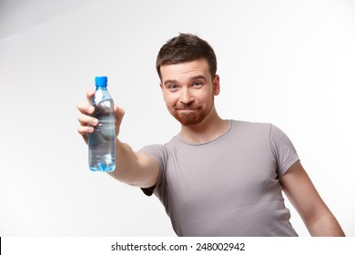 Man In Jeans And A T-shirt With Bottle Of Water 