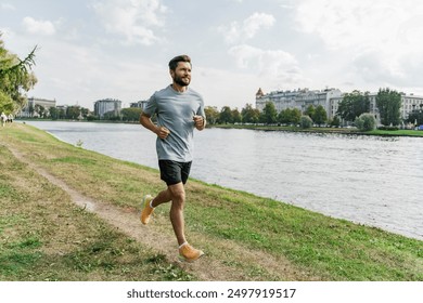 Man jogging along a serene riverside, urban landscape in the backdrop, embodying vitality and wellness.

 - Powered by Shutterstock