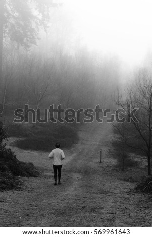 Similar – Man walking along the jetty