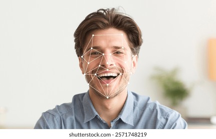 A man with a joyful expression showcases facial recognition technology. The system displays geometric patterns on his face, illustrating the identification process in a modern environment.