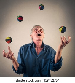 Man Juggling With Little Balls