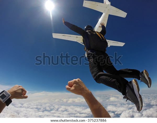 Man jump of\
plane, skydiving point of\
view.