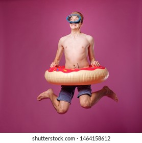 man jump in swimming circle on purple background, motion