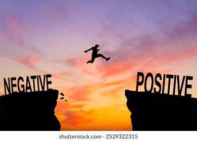 Man jump through the gap between Negative to Positive on sunset.