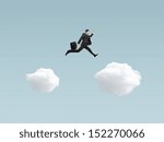 man jumping from cloud to another cloud