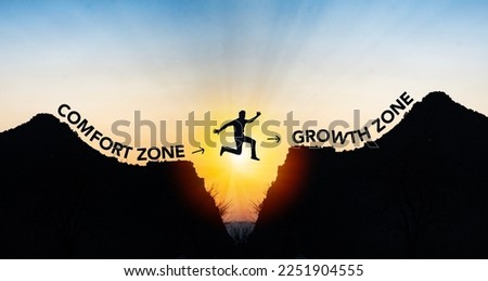 Man jumping from comfort zone to growth zone. Success and change concept .