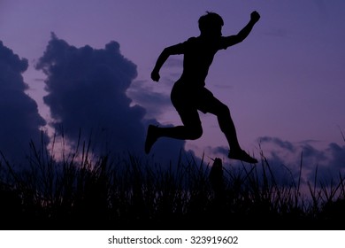 man jumping in the dark