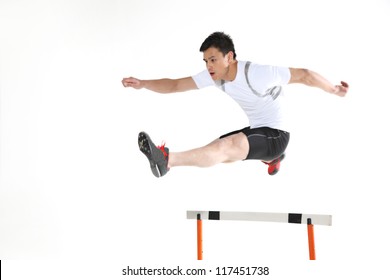 Man Jumping Hurdle