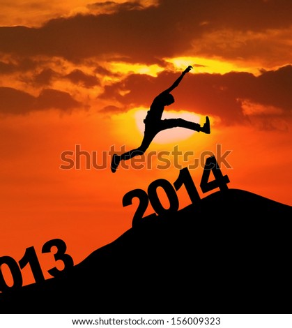 Man jumping over 2014 number to embrace the new year