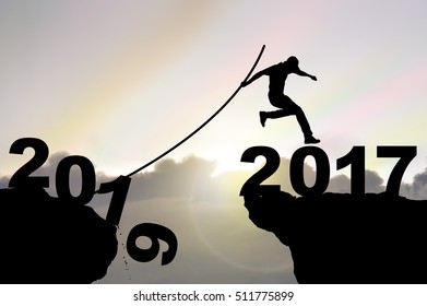 Man Jumping Over Precipice With Pole Vault On Iridescence Sky Background , Business People Success Happy New Year 2017 Concept