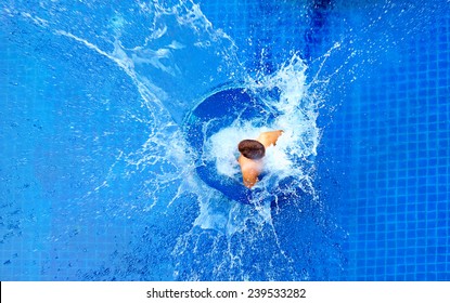 man jumping in pool, huge splash