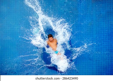 Man Jumping In Pool, Huge Splash, Top View