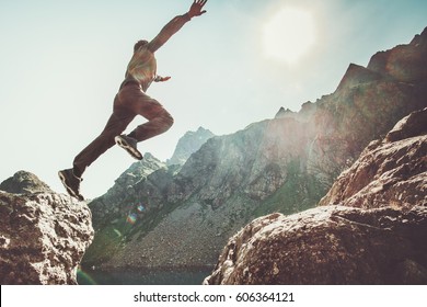 Man jumping to the sun in rocky mountains Travel Lifestyle happiness and success motivation concept adventure summer vacations outdoor mountaineering sport  - Powered by Shutterstock