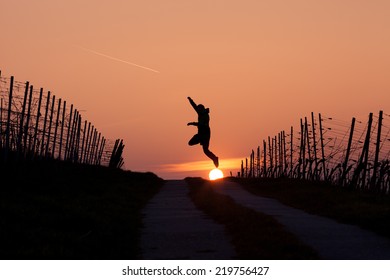 man jumping in sunset 