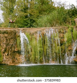 Man jumping from the waterfall