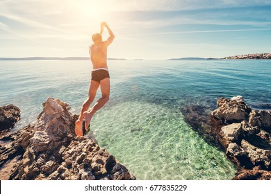 Man Jumps In Clear Crystal Water On Adriatic Sea Bay